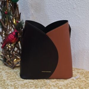 Bailly Du Bois The Bucket bag in brown and tan leather.